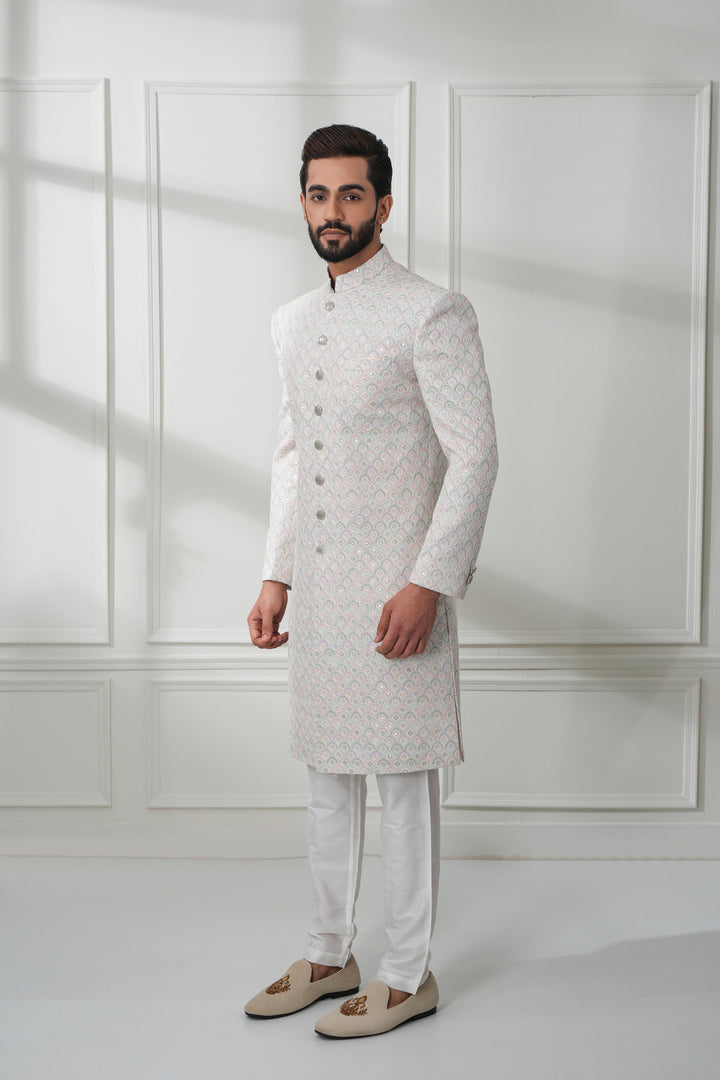Featuring A White Sherwani In Chikankari Base With Embroidery